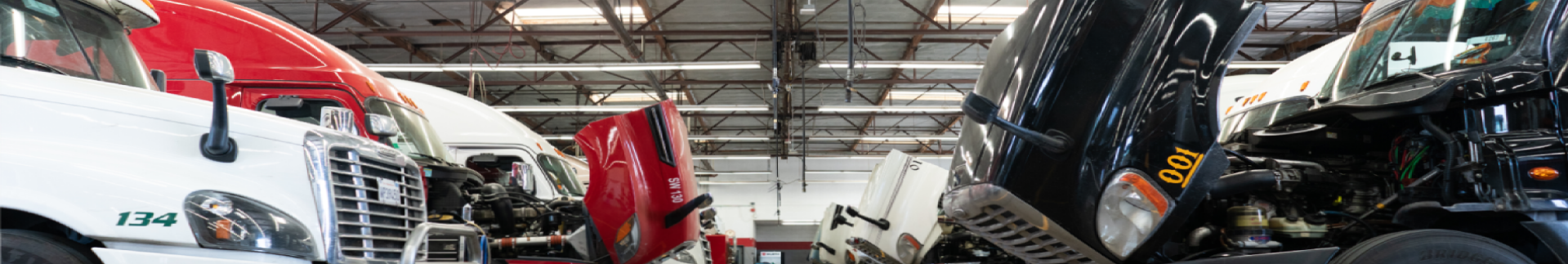 Semi trucks getting serviced in the shop at Delta Truck Center.