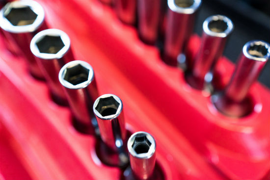 Sockets in a red tool box waiting to be used. 